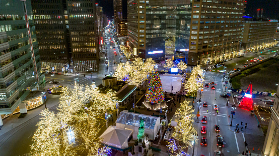 The christmas tree and lights in downtown Detroit, MI at night