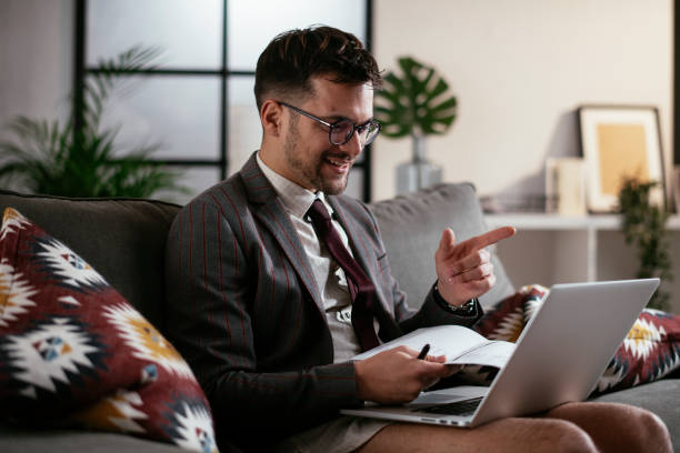 istock Businessman with no pants working at home. 1287362419