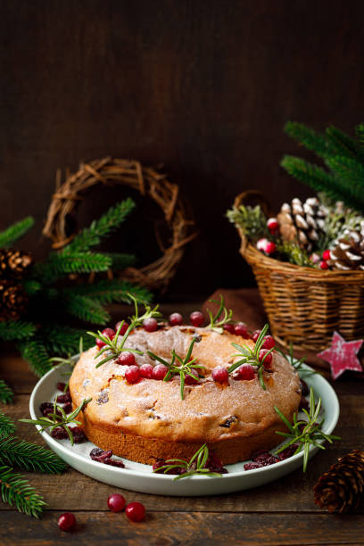 istock Christmas cranberry fruit cake with decorations on wooden background 1287366408
