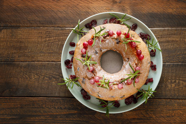 istock Christmas cranberry fruit cake with decorations on wooden background 1287366777