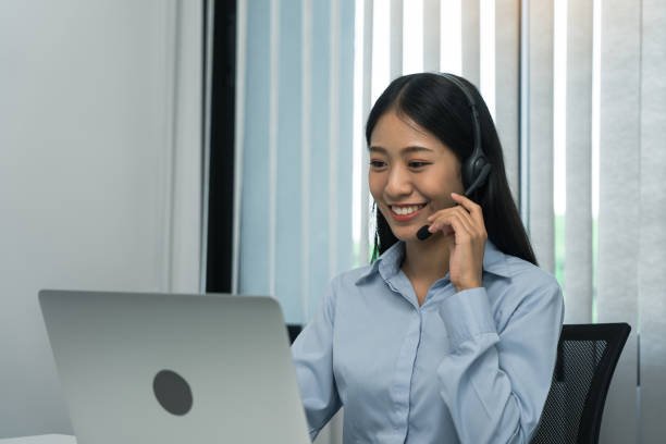 istock Close up call center worker was smiling at his office. 1287368968