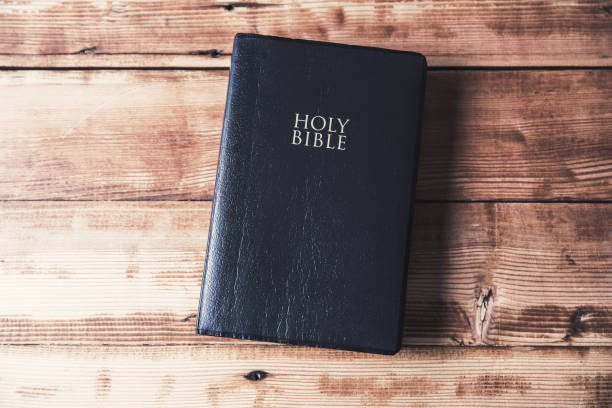 istock Holy Bible on the brown table 1287371848
