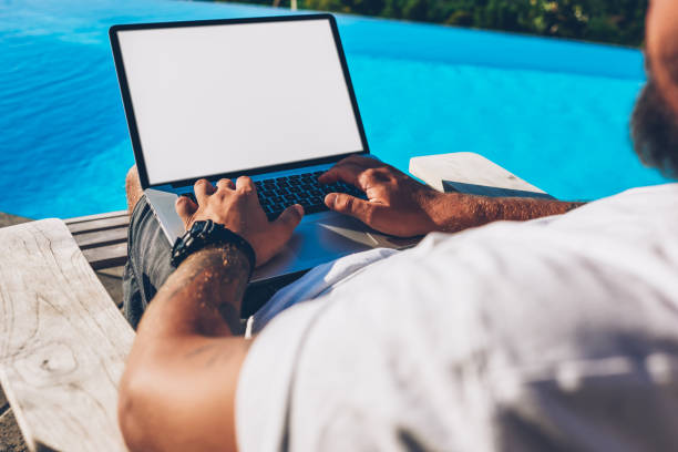 istock Cropped image of male hands typing text information on keyboard of modern laptop computer with blank copy space screen for your advertising content during remote work in summertime 1287375021