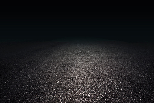 Spotlights projected on the pavement, abstract background.