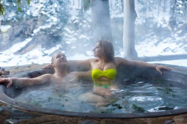 istock people in hot baths with thermal waters in the mountains in winter 1287376479