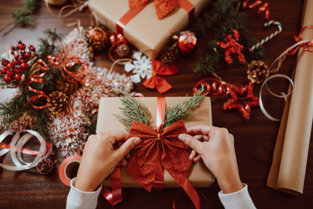 istock Woman wrapping Christmas presents 1287381511