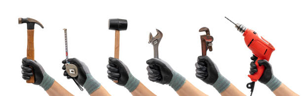 istock Collection of hands holding hand tools isolated white background. Diy concept. Hand tools concept. 1287382883