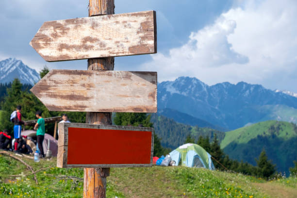 istock Pointer with direction in the mountains. Directional signs against mountains. 1287383009
