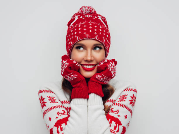 istock Beautiful woman wearing hat and mittens 1287384006