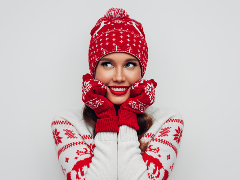 Beautiful woman wearing hat and mittens