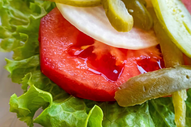 tomato and cucumber pickle, onion and lettuce slices