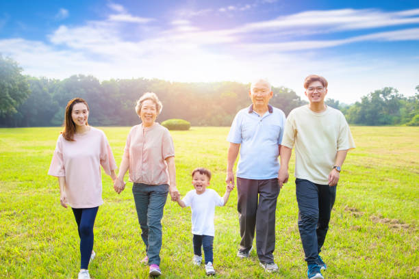 istock three generation asian family walking  in the park 1287387598