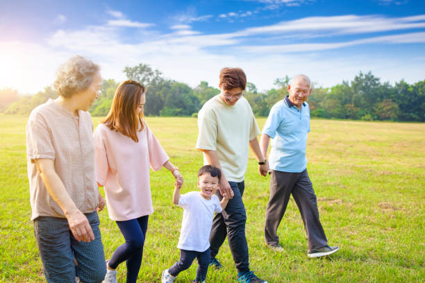 istock three generation asian family walking  in the park 1287387627