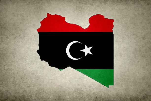 Photo of Grunge map of Libya with its flag printed within