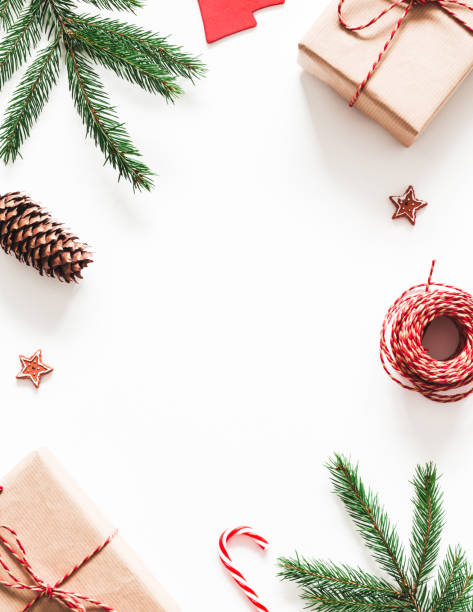 istock Christmas composition. Christmas gifts, fir tree branches, decorations on white background. Flat lay, top view 1287389317