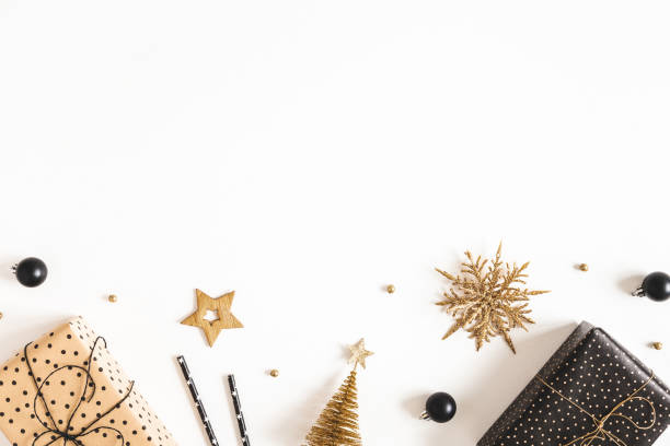 istock Christmas composition. Gift boxes, black and golden decorations on white background. Christmas, winter, new year concept. Flat lay, top view, copy space 1287389359