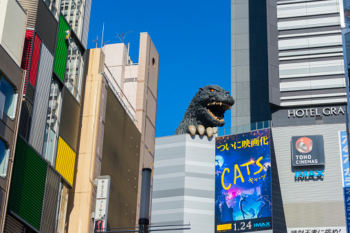 Tokyo, Japan - January 6,2020 : Godzilla on top of building billboard in Shinjuku ward in Tokyo, Japan on January 6,2020.