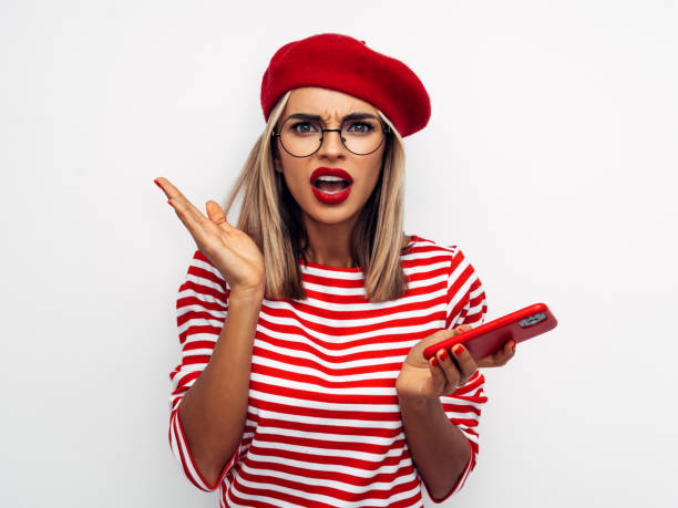istock Beautiful unhappy woman using smart phone 1287390872