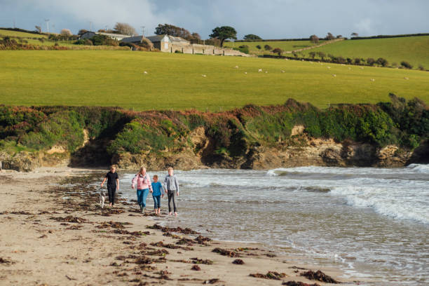 istock Family Walk Along the Beach in Cornwall 1287391931