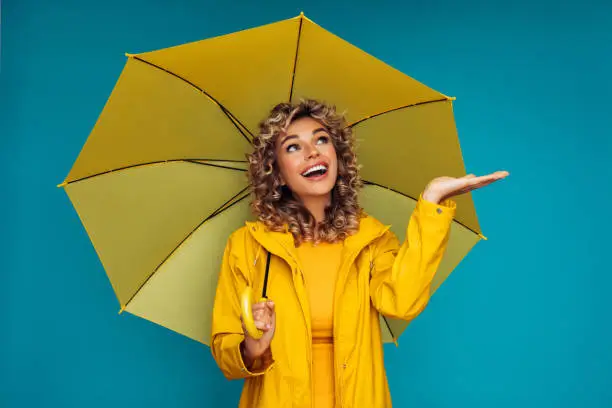 Photo of Girl with yellow umbrella