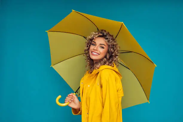Photo of Girl with yellow umbrella