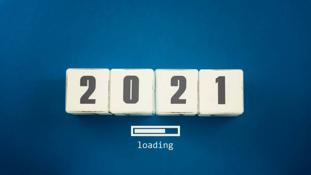 istock Top view of wooden cubes with 2021 text and progress loading bar new year concept 1287392386