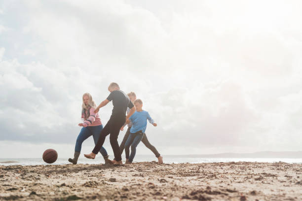istock Family Playing Football 1287393713