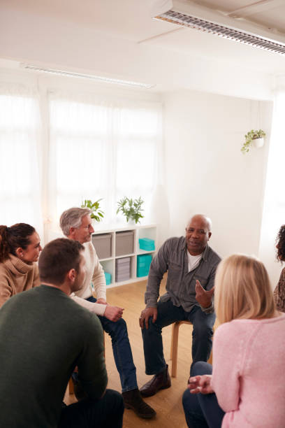 istock People Attending Support Group Meeting For Mental Health Or Dependency Issues In Community Space 1287393911