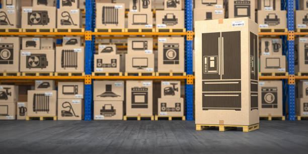 istock Refrigerator in warehouse with household appliances and kitchen electronics in boxes. Online purchase, shopping  and delivery concept. 1287394677