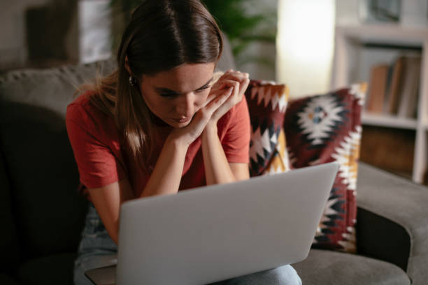 istock Worried woman using laptop. 1287395364