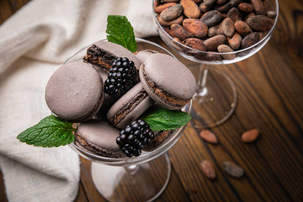 Macaroon with berries on a wooden table