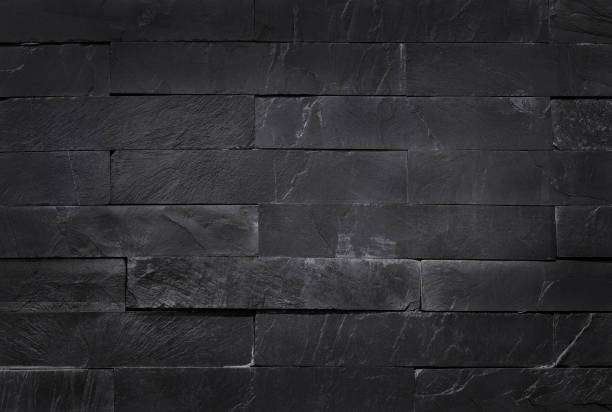 istock Dark grey black slate texture in natural pattern with high resolution for background and design art work. Brick stone wall. 1287396638