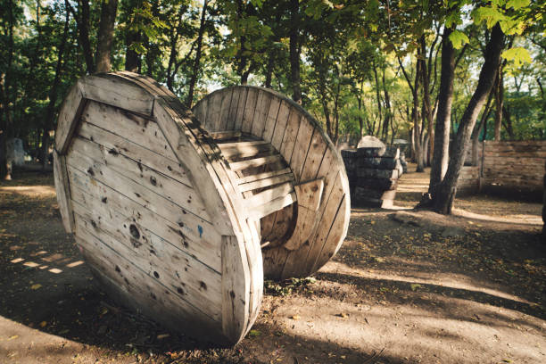 istock Old wooden round building at the base for a paintball game 1287399094