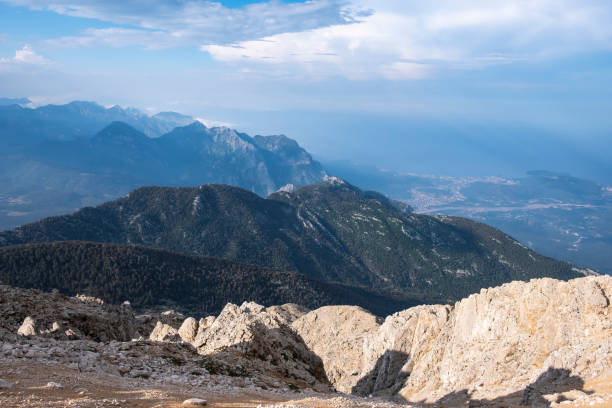 istock Beautiful view to Western Taurus mountain range with cloudy sky, captured from Tahtali mountain's peak. 1287399170