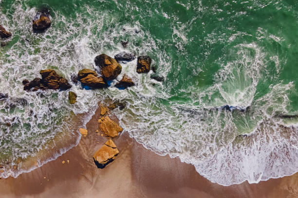 istock Aerial view of sea waves on the shore 1287399324