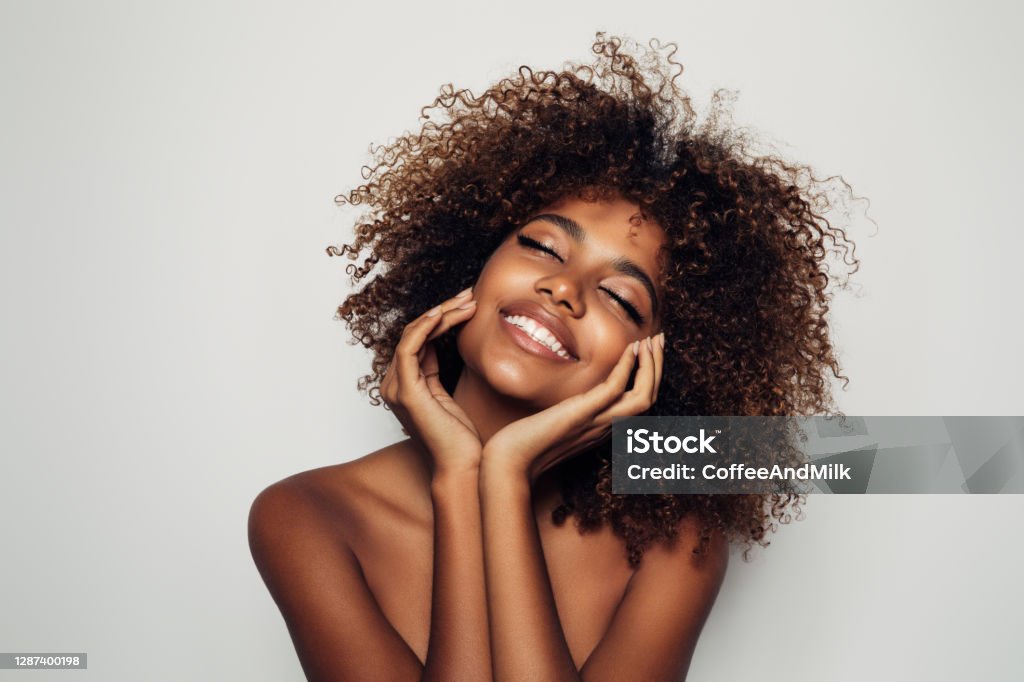 Beautiful afro woman with perfect make-up Women Stock Photo