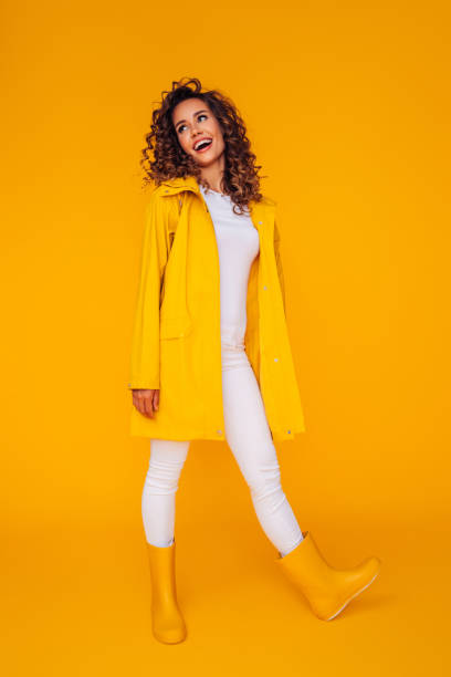 Studio shot of a young beautiful woman Studio shot of a young beautiful woman yellow shoes stock pictures, royalty-free photos & images