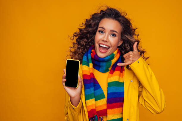 istock Beautiful girl with smart phone gesturing 1287400418
