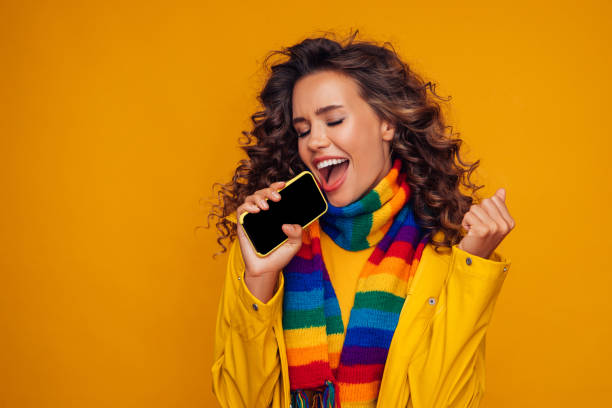 istock Beautiful girl with smart phone 1287400474