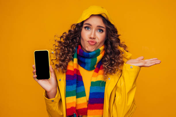 istock Beautiful disappointed girl with smart phone gesturing 1287400549