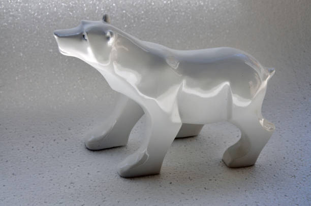 istock Ceramic white polar bear ornament on simulated snow field 1287400693