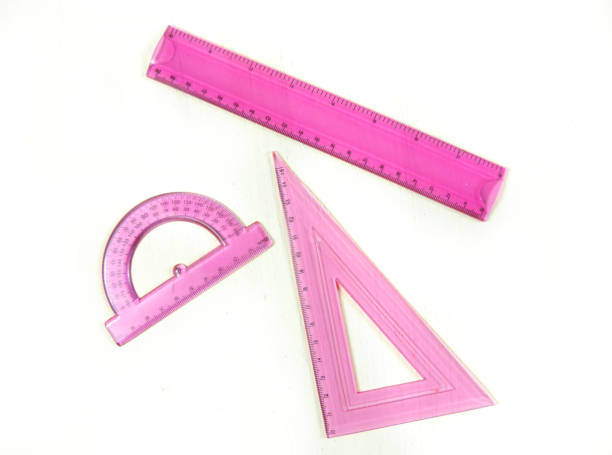 istock Set of pink measuring tools: rulers, triangles, protractor. Correct form and sizes. Metric system of measurements: centimeters and millimeters. 1287400933