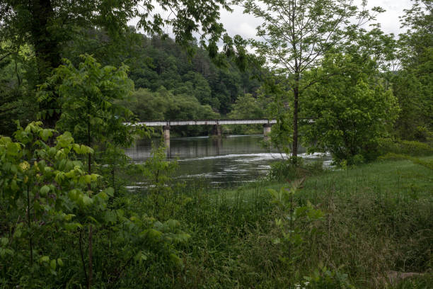 istock Bridge crossing river at Reliance TN 1287403664