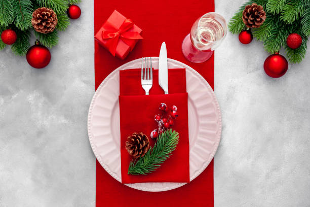 istock Christmas table setting with fir tree and bottle with glasses 
