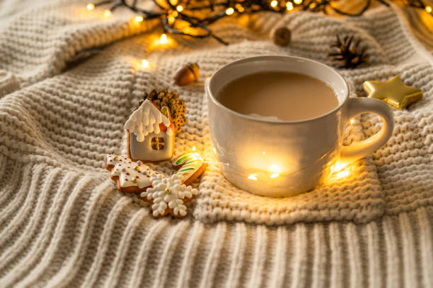istock Christmas decor. Mug and Christmas cookies on a knitted sweater 1287406376