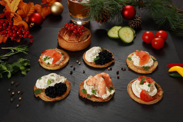 Savory Blini Pancakes A selection of Savory Blini an Russian or Ukrainian cuisine with Blini Pancakes and cream cheese with festive decoration blini photos stock pictures, royalty-free photos & images