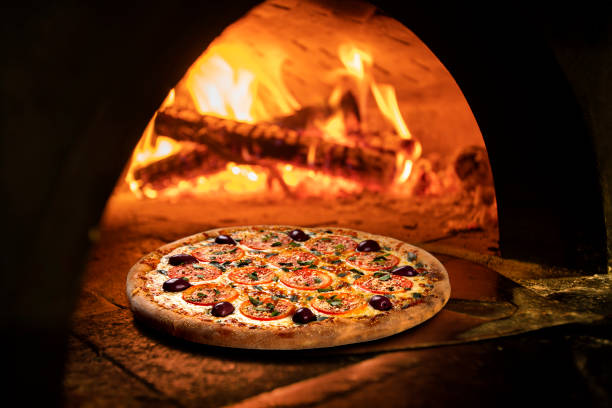 istock Image of a brick pizza oven with fire 1287410277