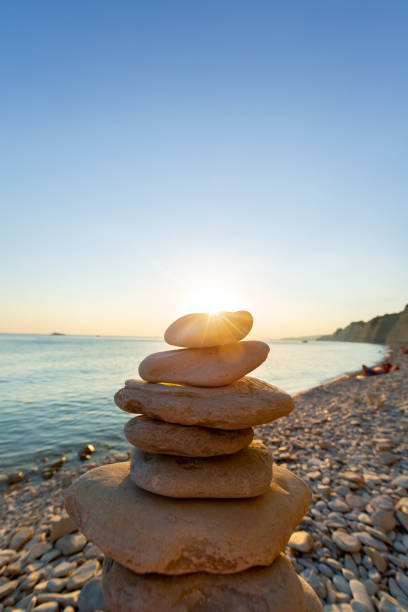 istock pebbles on the background of sunset by the sea 1287411621