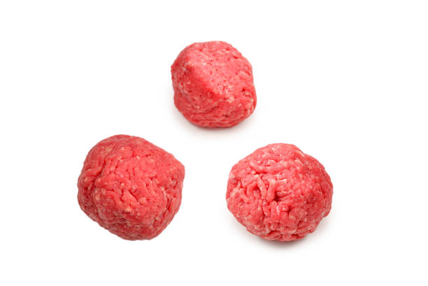 istock Raw meat balls isolated on white background. 1287411788