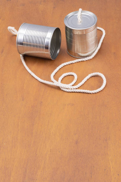 istock Cans joined by cord as a telephone 1287412864